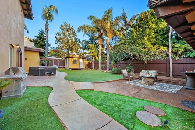 a view of a patio with a table and chairs