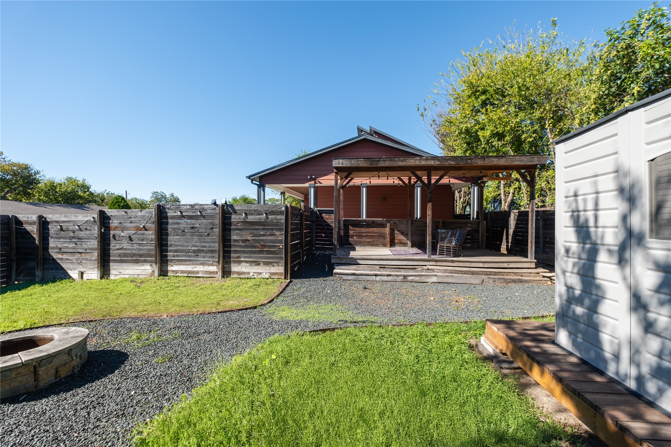 7601 Bethune Avenue, Unit B Austin, TX 78752 - Photo 39 of 39 Fenced backyard featuring a deck and a fire pit