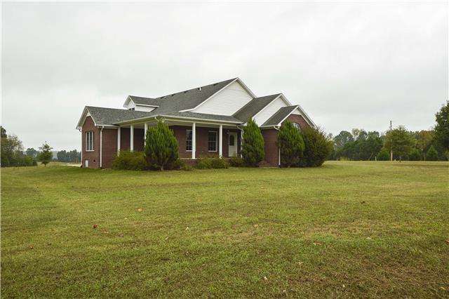 272 Revilo Road Leoma, TN 38468 - Photo 1 of 20 a front view of a house with a yard