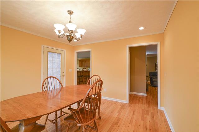 272 Revilo Road Leoma, TN 38468 - Photo 11 of 20 a view of a dining room with furniture and chandelier
