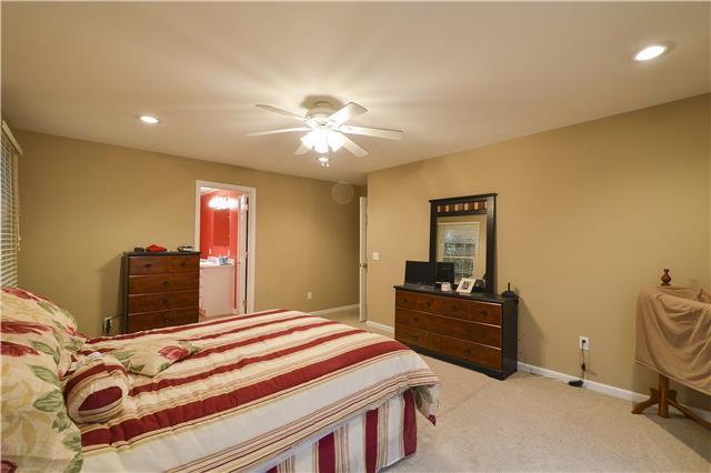 272 Revilo Road Leoma, TN 38468 - Photo 14 of 20 a bedroom with a bed and furniture