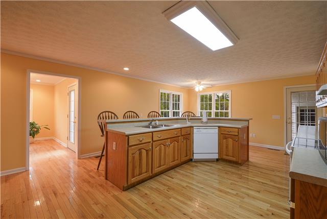 272 Revilo Road Leoma, TN 38468 - Photo 7 of 20 a spacious bathroom with a granite countertop sink and a mirror