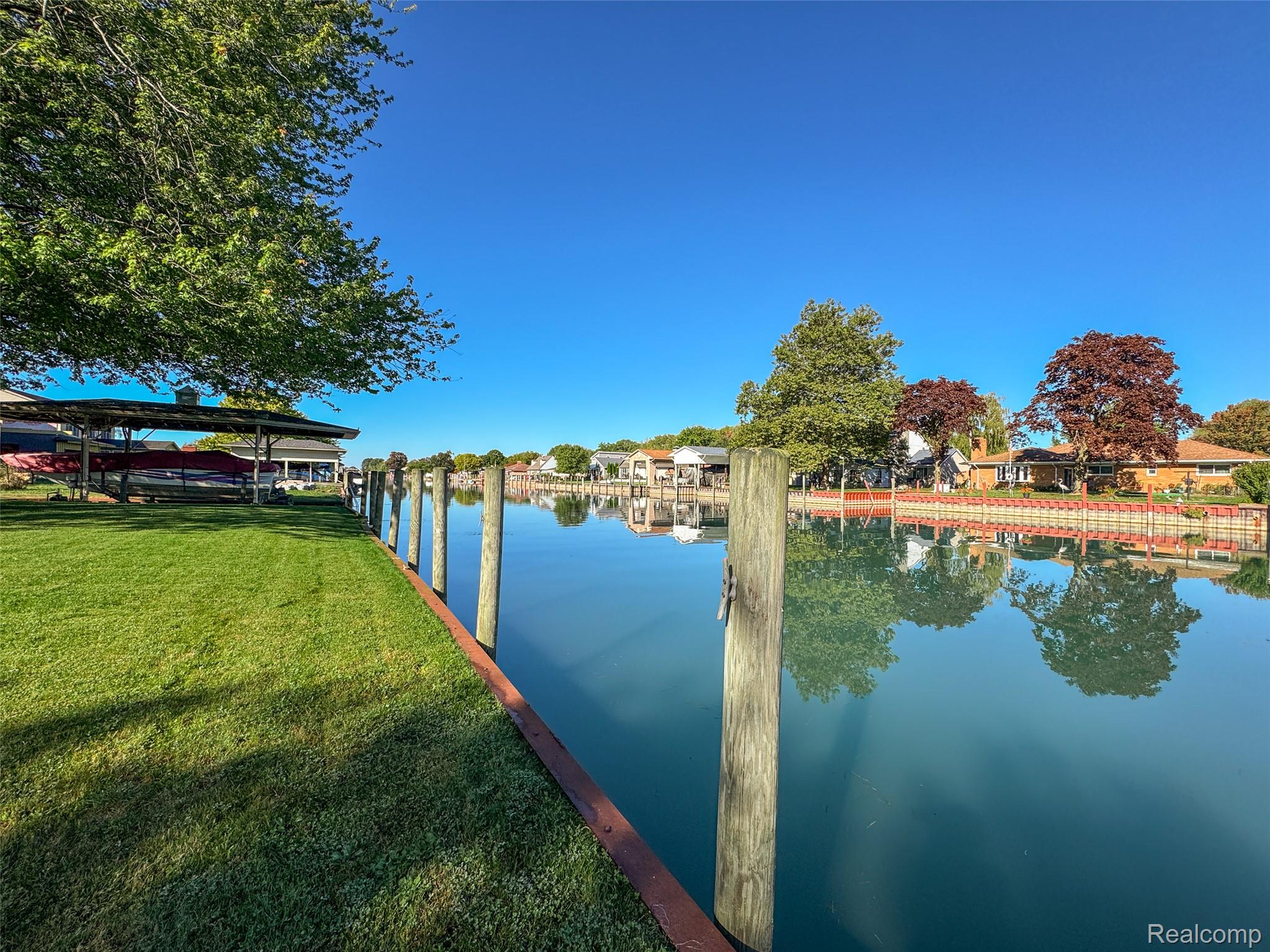 7214 Cardinal Road Algonac, MI 48001 - Photo 39 of 51 Dock area featuring a water view and a yard