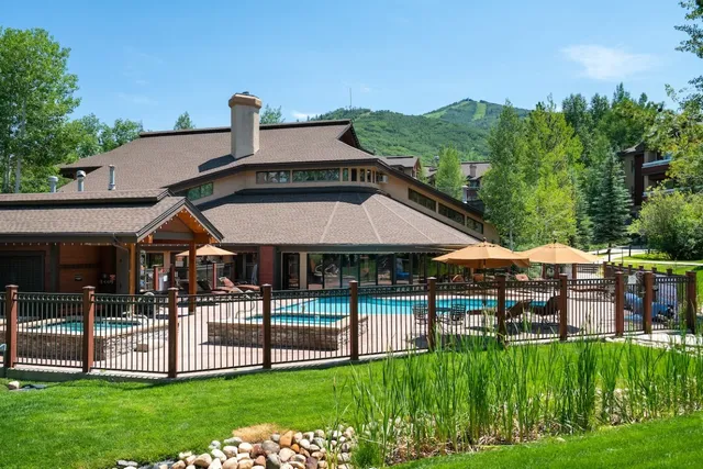 a front view of a house with a yard table and chairs