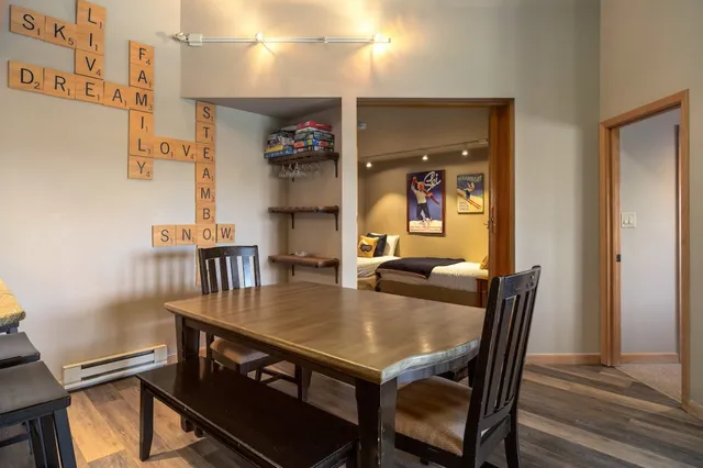 a view of a dining room with furniture and wooden floor