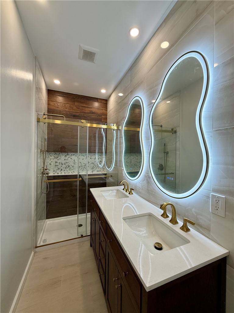 171 Cedarwood Terrace Rochester, NY 14609 - Photo 12 of 29 And, a beautifully tiled step-in shower with built-in niche.