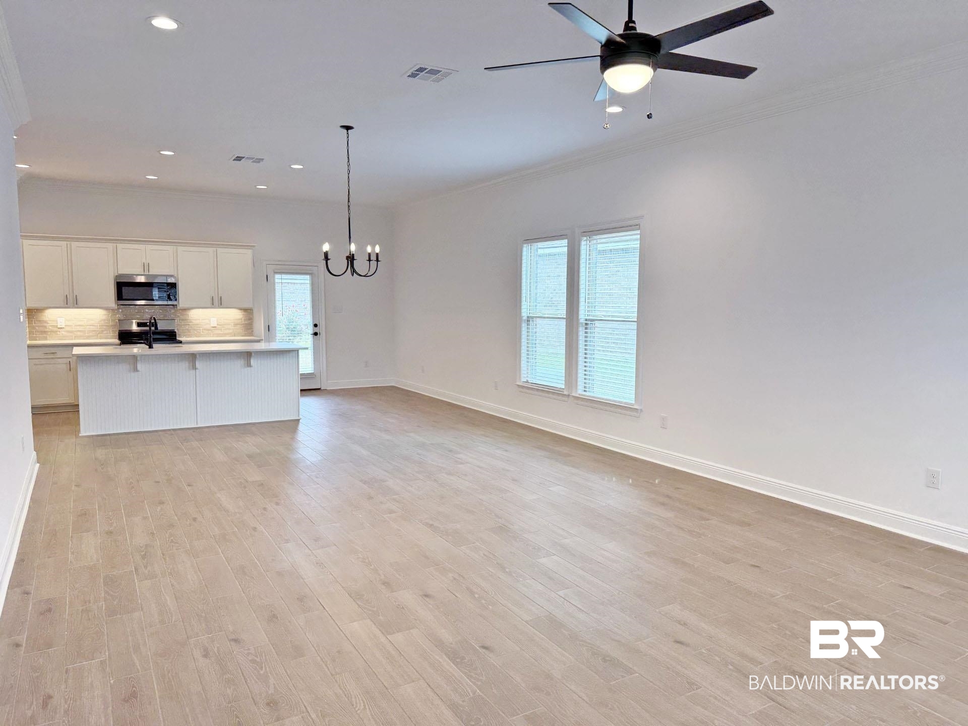 1753 Breckinridge Place Foley, AL 36535 - Photo 8 of 24 Open-concept living area featuring light wood-finish flooring, recessed lighting, and a modern ceiling fan