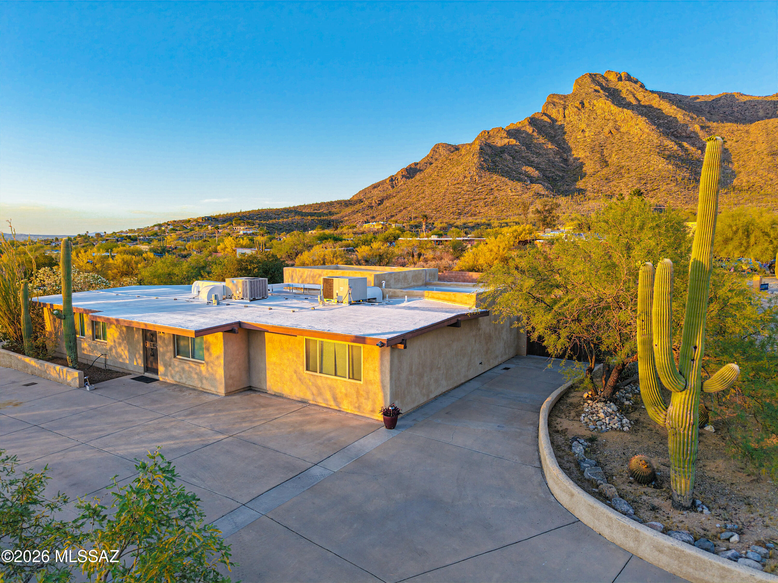 545 East Rancho Catalina Place Tucson, AZ 85704 - Photo 5 of 13 a view of a swimming pool with an outdoor seating and a terrace view