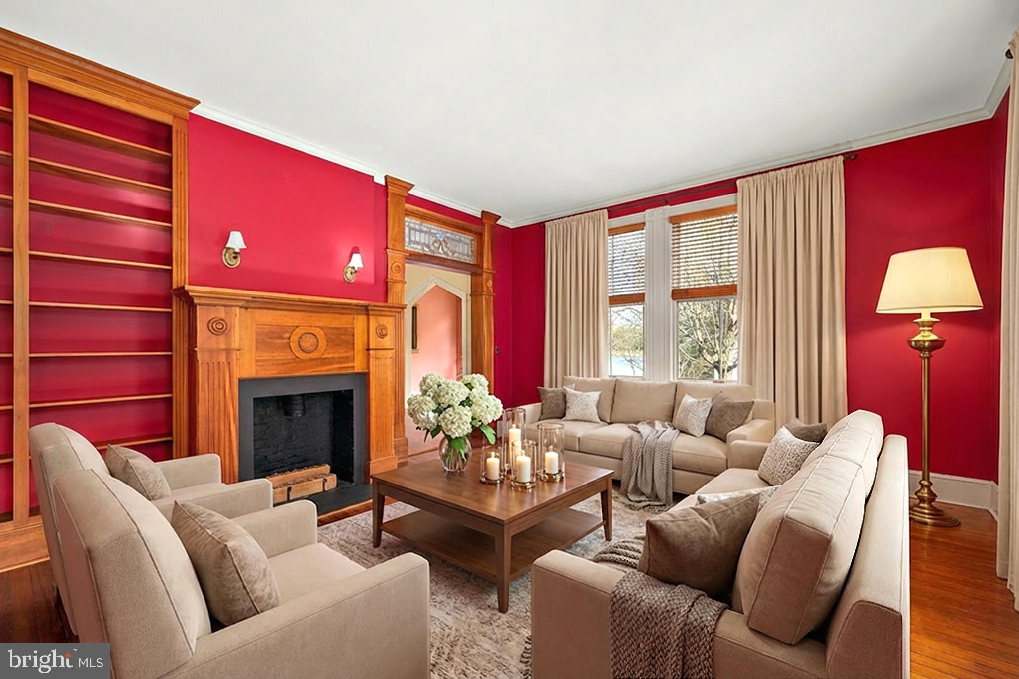 26090 Royal Oak Road Easton, MD 21601 - Photo 13 of 74 a living room with furniture a fireplace and a large window