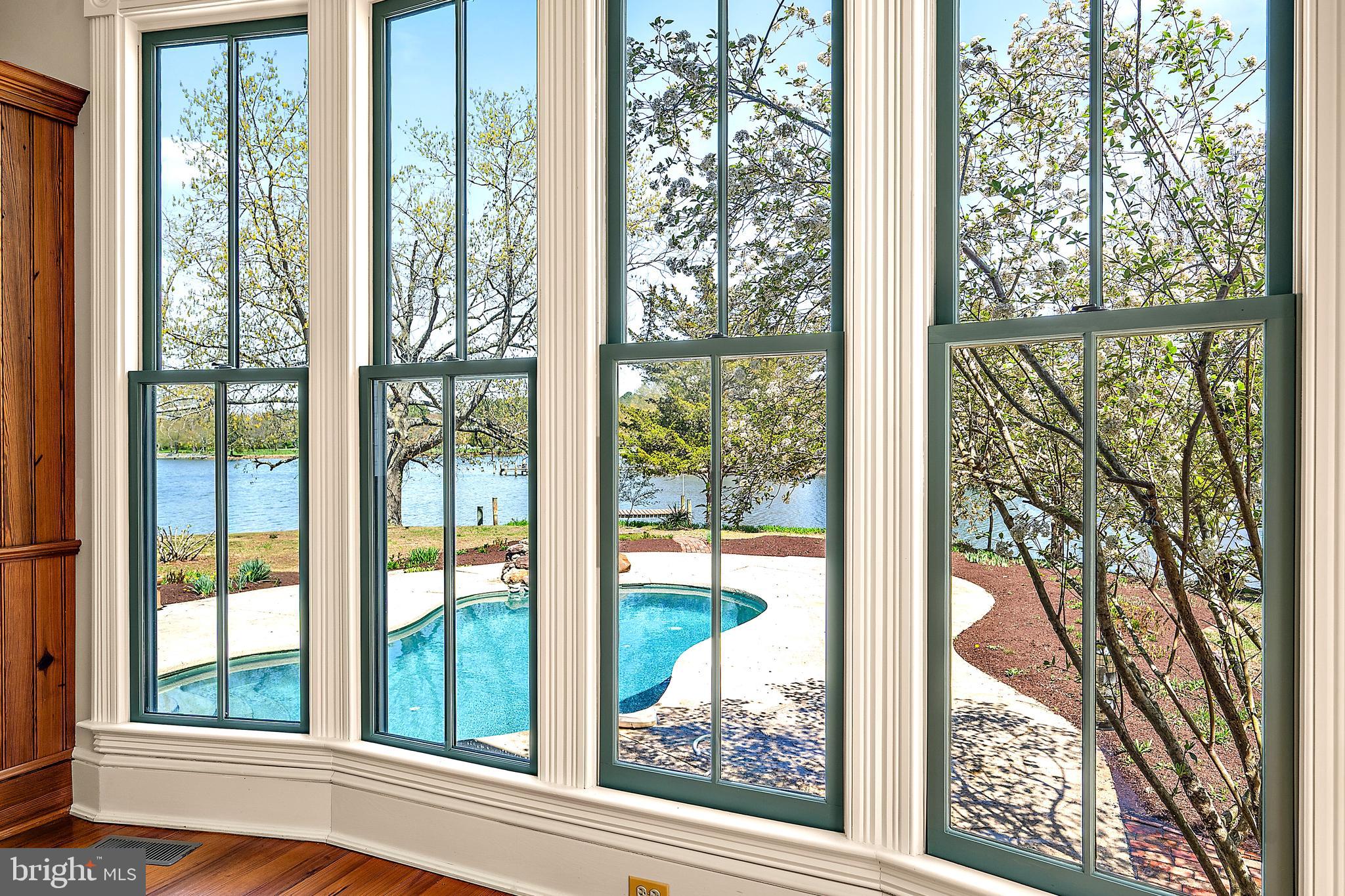 26090 Royal Oak Road Easton, MD 21601 - Photo 20 of 74 a view of a room with a large window and front door