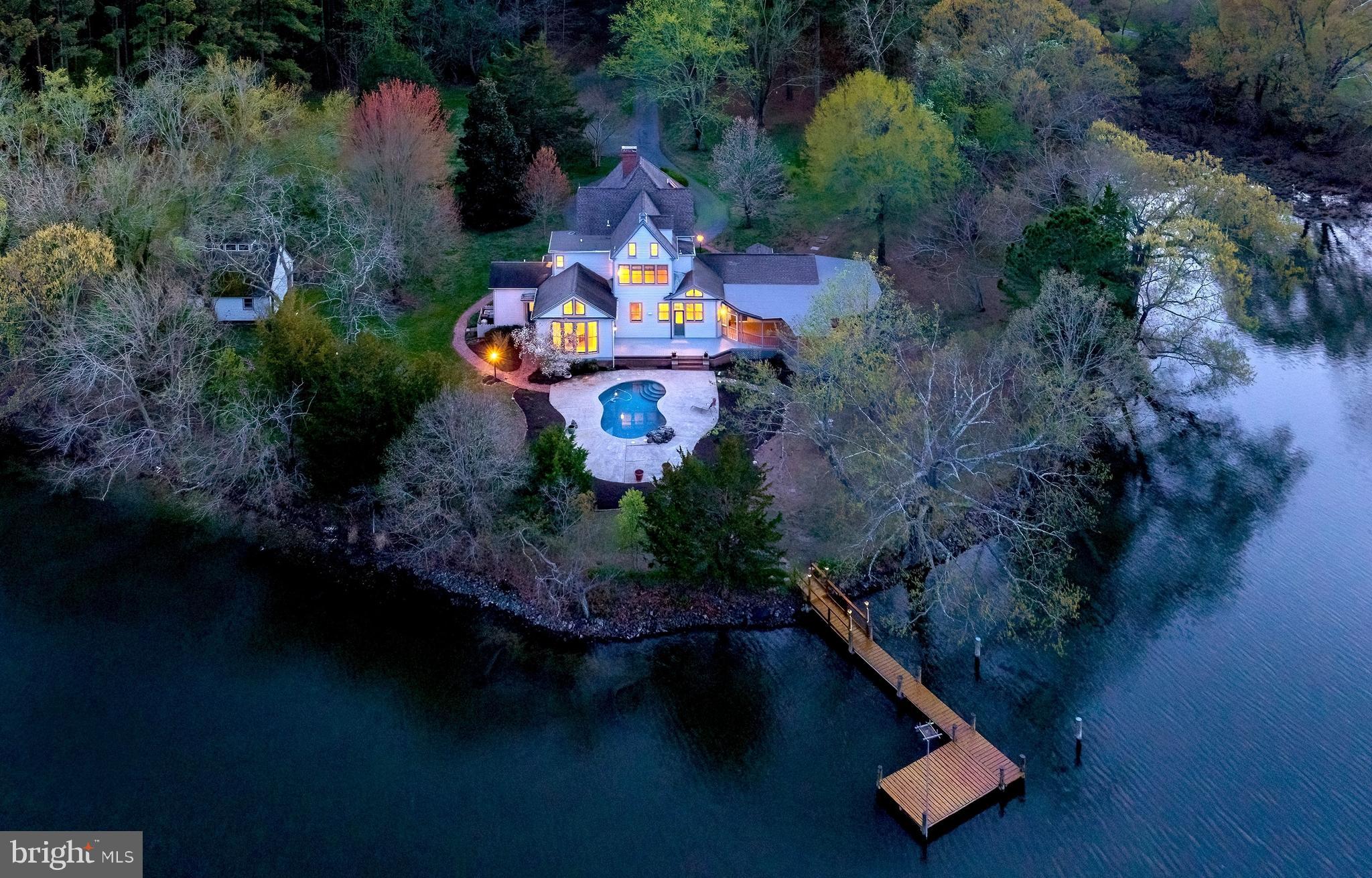 26090 Royal Oak Road Easton, MD 21601 - Photo 2 of 74 an aerial view of a house with outdoor space swimming pool and outdoor seating