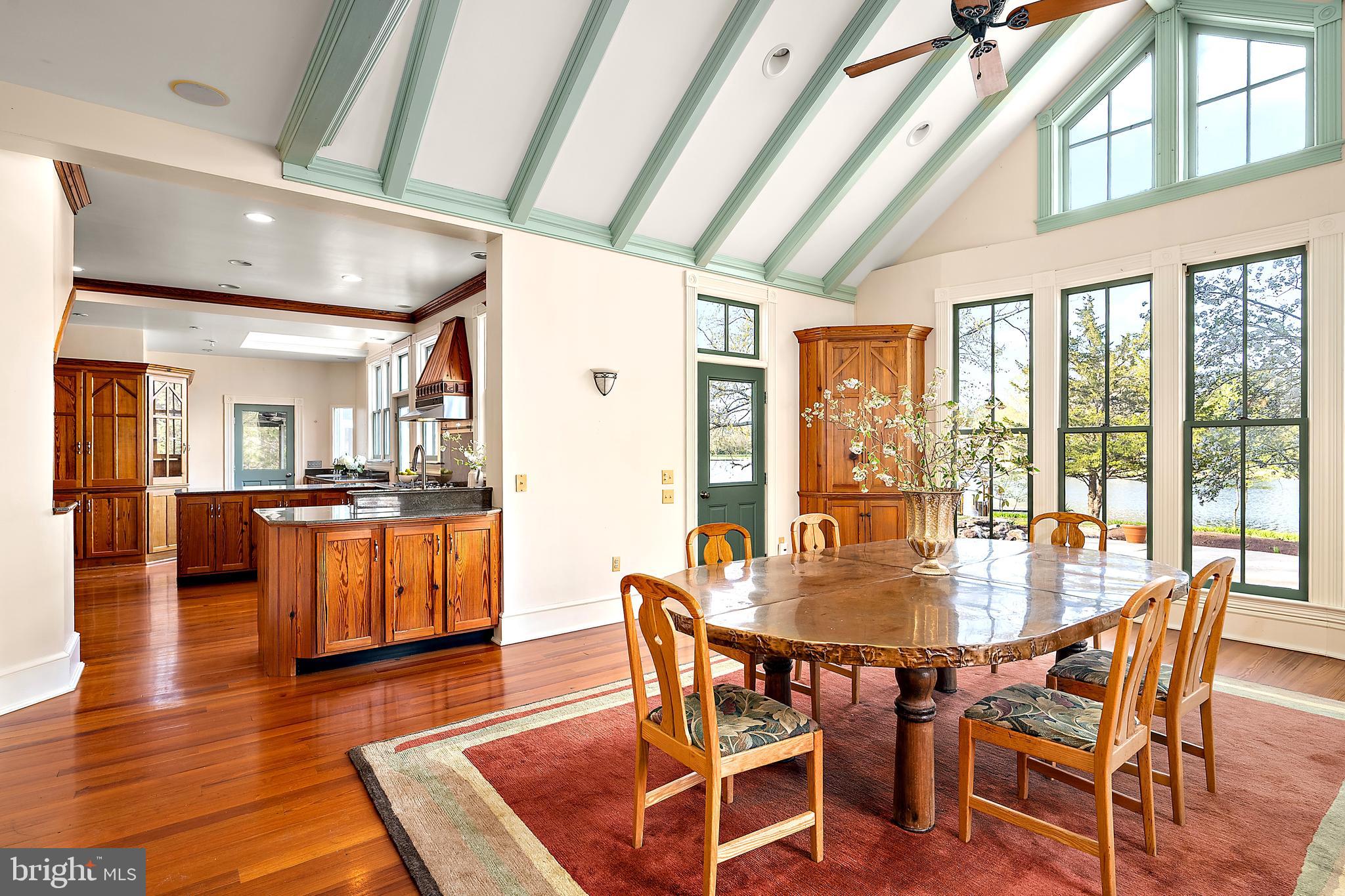 26090 Royal Oak Road Easton, MD 21601 - Photo 21 of 74 a dining room with furniture window wooden floor