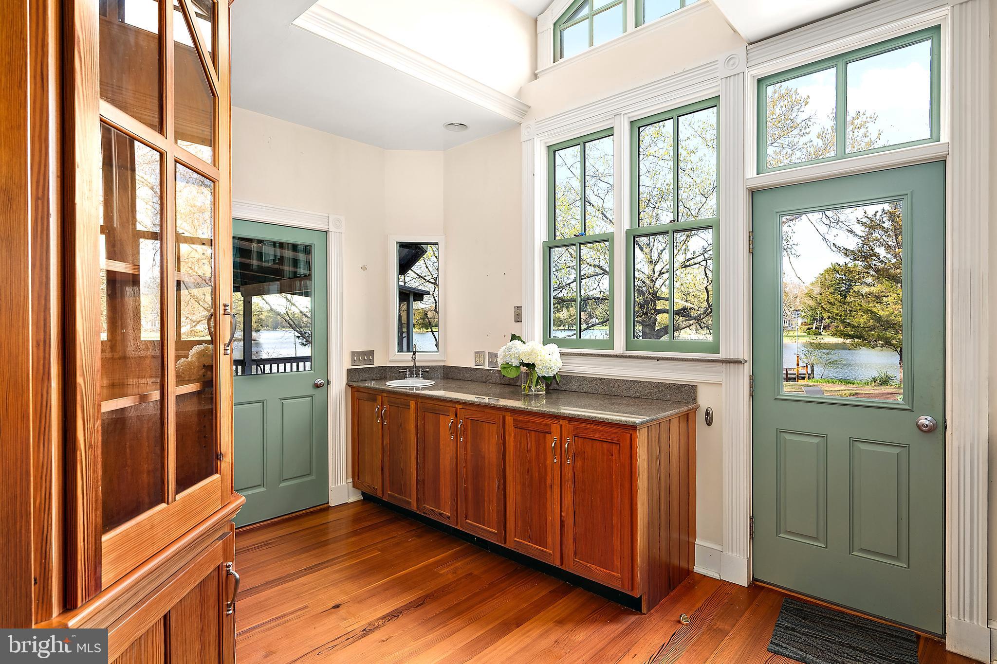 26090 Royal Oak Road Easton, MD 21601 - Photo 25 of 74 a kitchen with stainless steel appliances granite countertop a refrigerator a sink and wooden cabinets