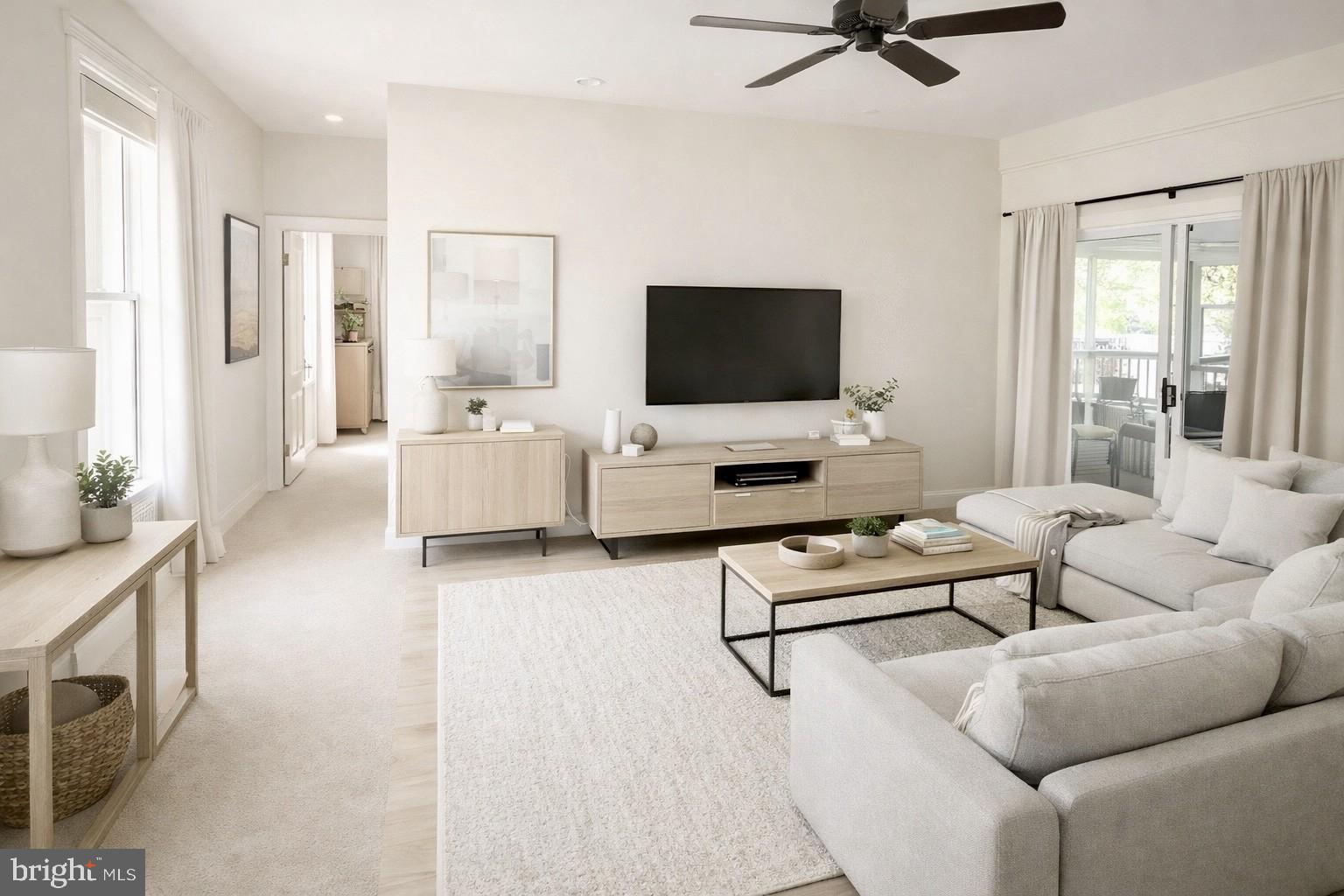 26090 Royal Oak Road Easton, MD 21601 - Photo 27 of 74 a living room with furniture and a flat screen tv