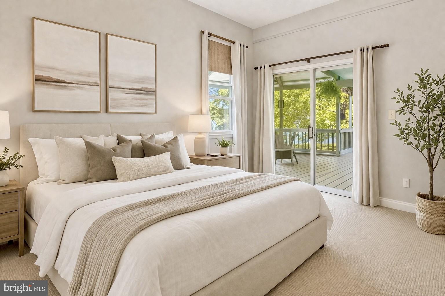 26090 Royal Oak Road Easton, MD 21601 - Photo 28 of 74 a bedroom with a large bed and a large window