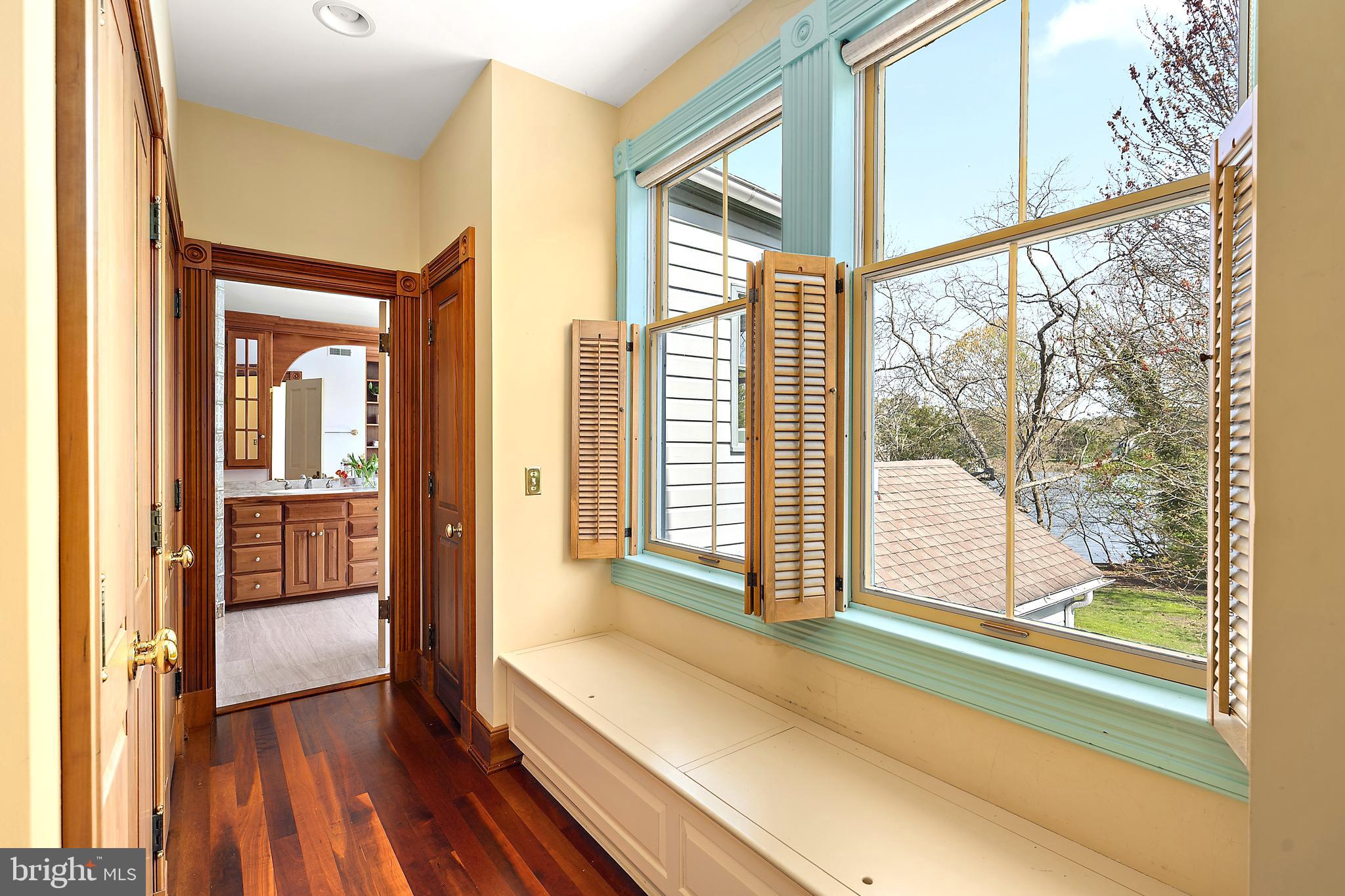26090 Royal Oak Road Easton, MD 21601 - Photo 37 of 74 a view of a room with wooden floor and windows