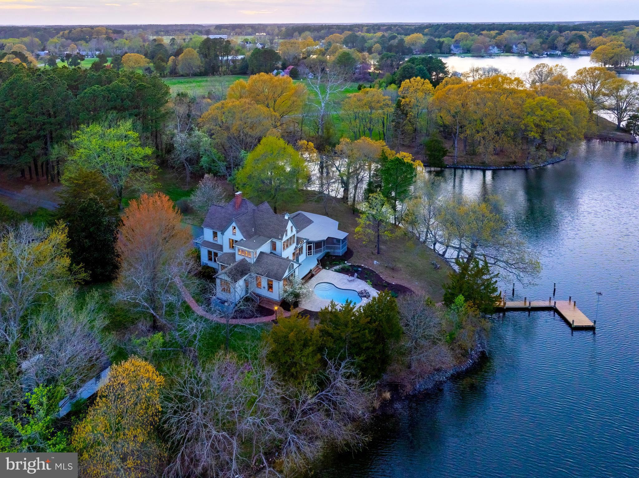 26090 Royal Oak Road Easton, MD 21601 - Photo 4 of 74 an aerial view of lake residential house with swimming pool and outdoor space