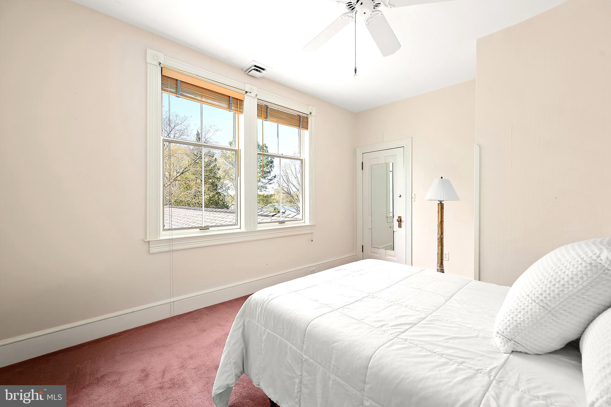 26090 Royal Oak Road Easton, MD 21601 - Photo 41 of 74 a bedroom with a bed and a window