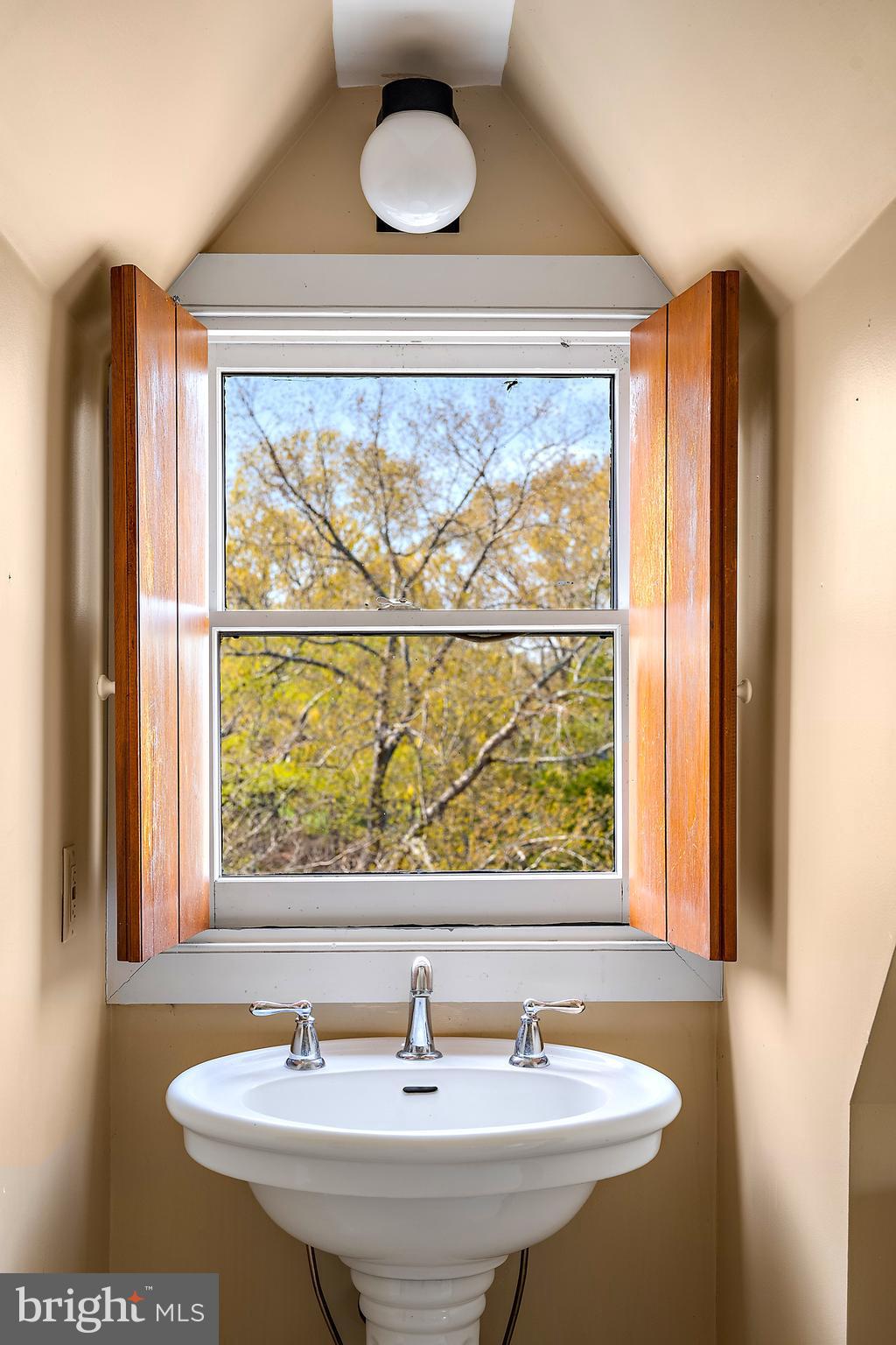 26090 Royal Oak Road Easton, MD 21601 - Photo 48 of 74 a bathroom with a sink and a window
