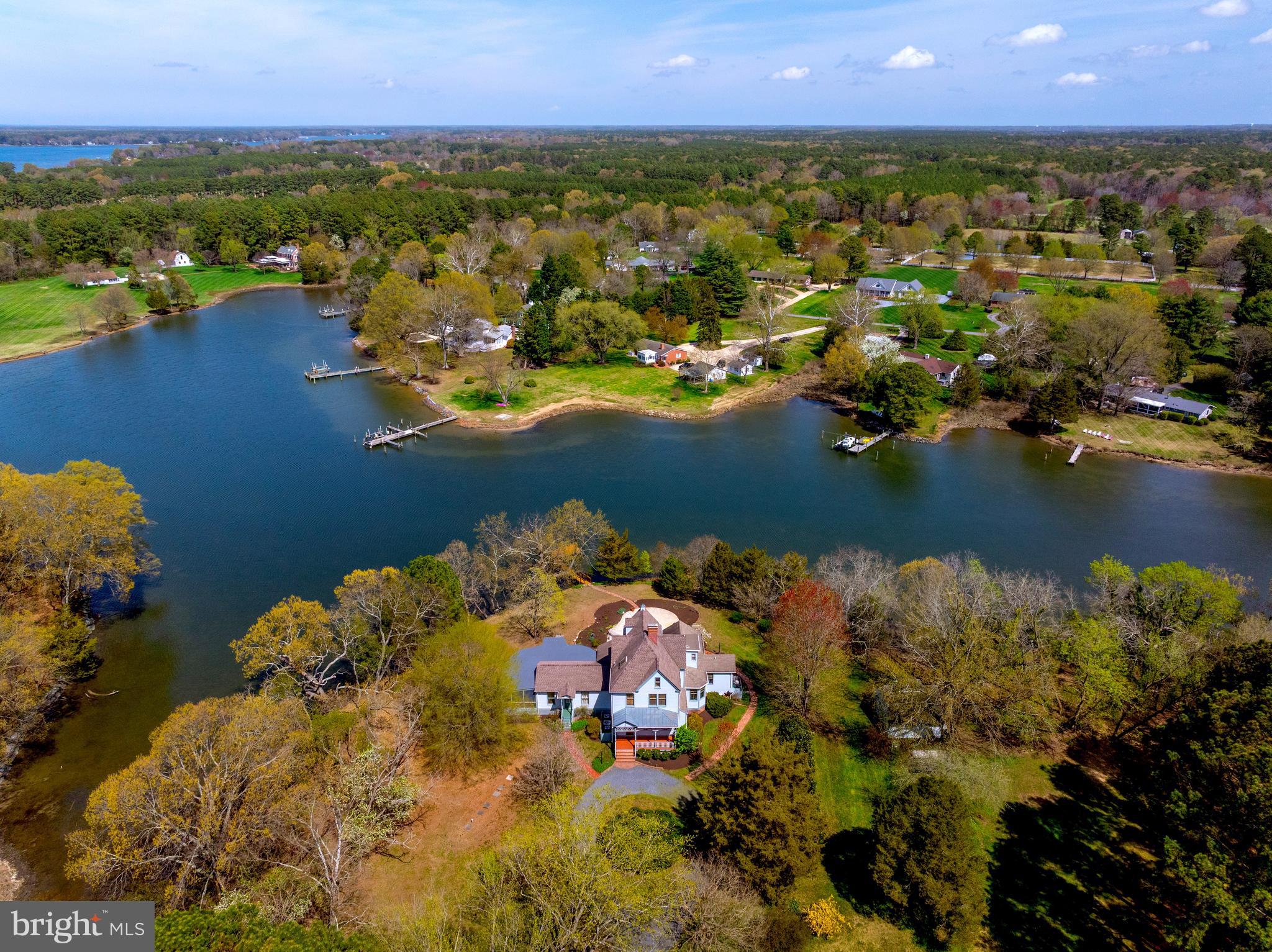 26090 Royal Oak Road Easton, MD 21601 - Photo 62 of 74 an aerial view of residential house with outdoor space and lake view