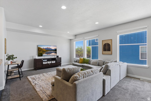 370 West Knights Lane Layton, UT 84041 - Photo 15 of 31 Spacious living area featuring light gray walls, recessed lighting, and multiple windows with white blinds