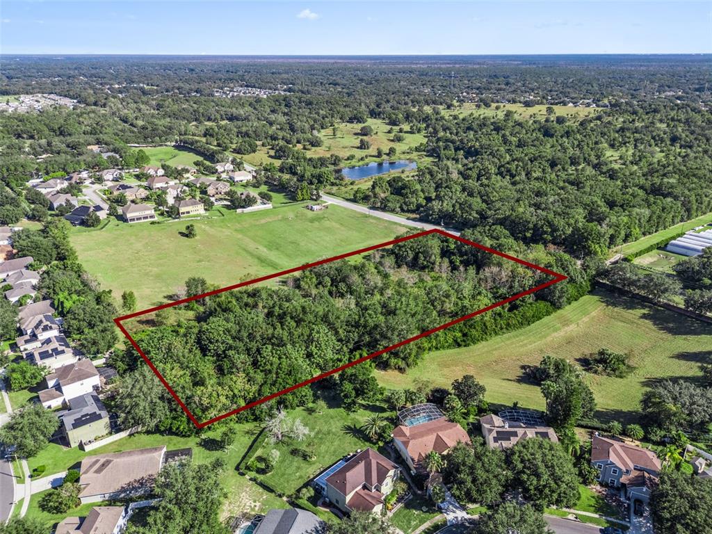 2228 Vick Road Apopka, FL 32712 - Photo 11 of 26 a view of a city with a lake