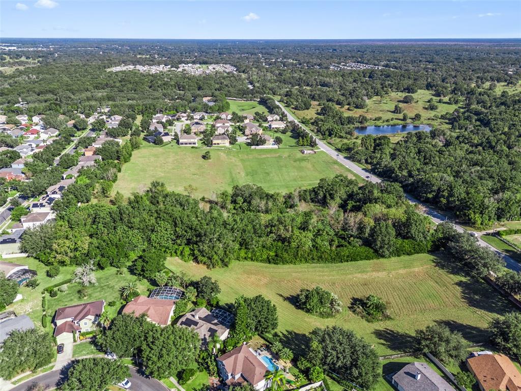 2228 Vick Road Apopka, FL 32712 - Photo 14 of 26 an aerial view of residential houses with outdoor space and trees