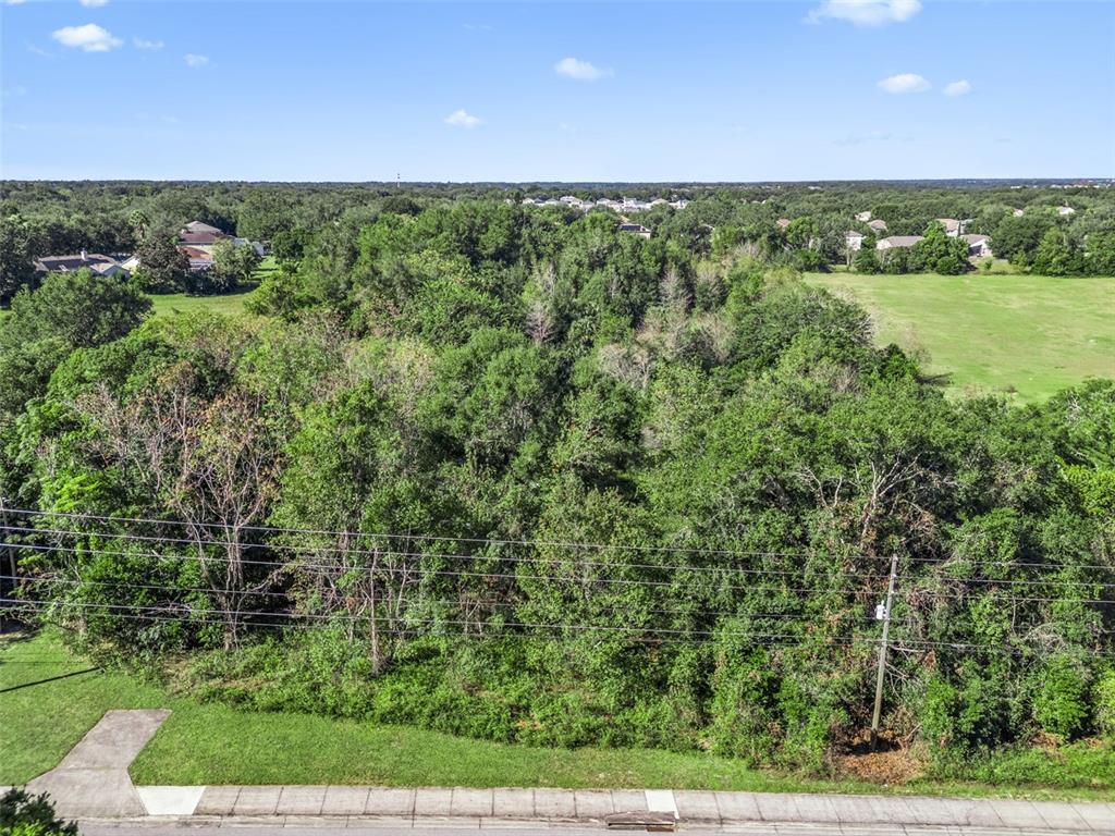 2228 Vick Road Apopka, FL 32712 - Photo 17 of 26 a view of an outdoor space and a yard