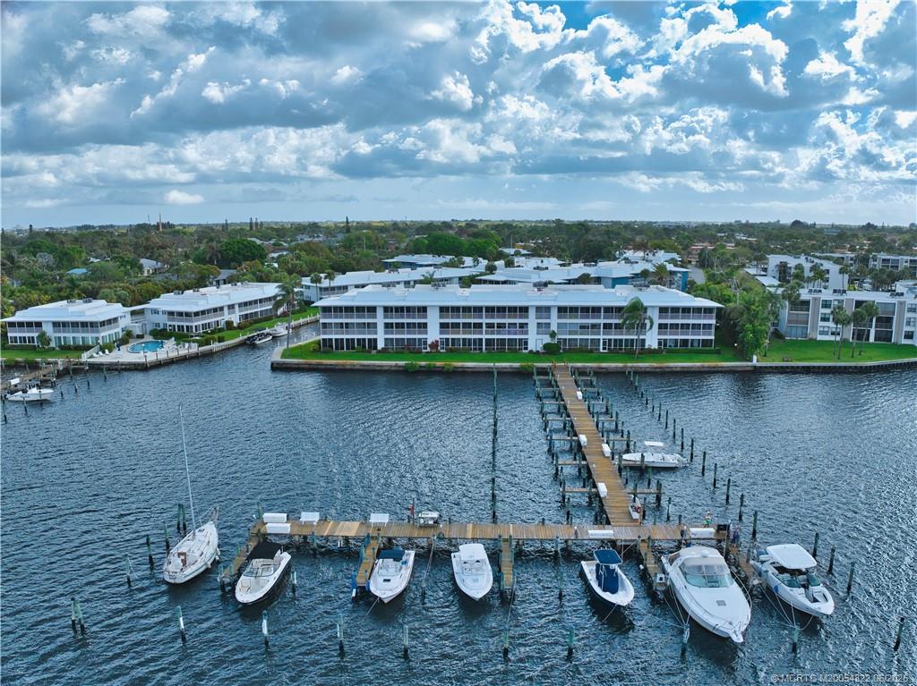 1862 Southwest Palm City Road, Unit 203 Stuart, FL 34994 - Photo 37 of 39 a view of a lake with houses