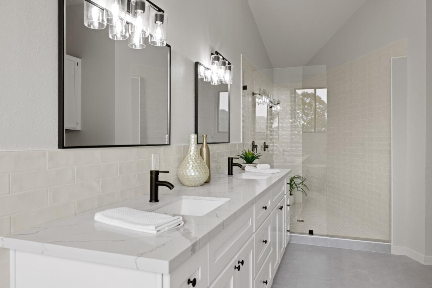 3465 Rio Road Carmel, CA 93923 - Photo 14 of 28 a bathroom with a sink double vanity and a mirror