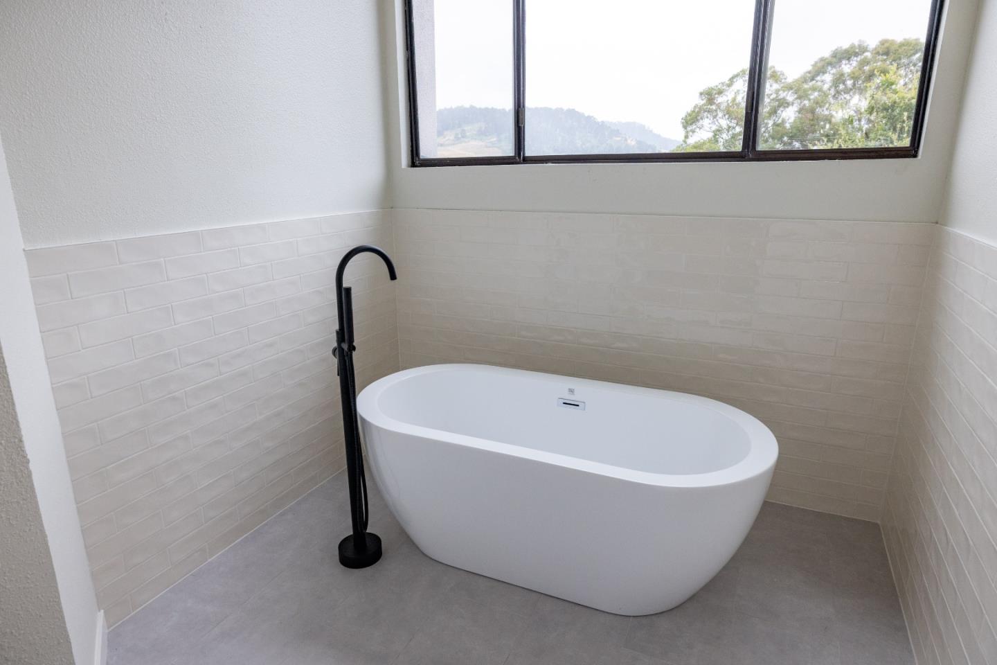 3465 Rio Road Carmel, CA 93923 - Photo 17 of 28 a white bath tub sitting in a bathroom