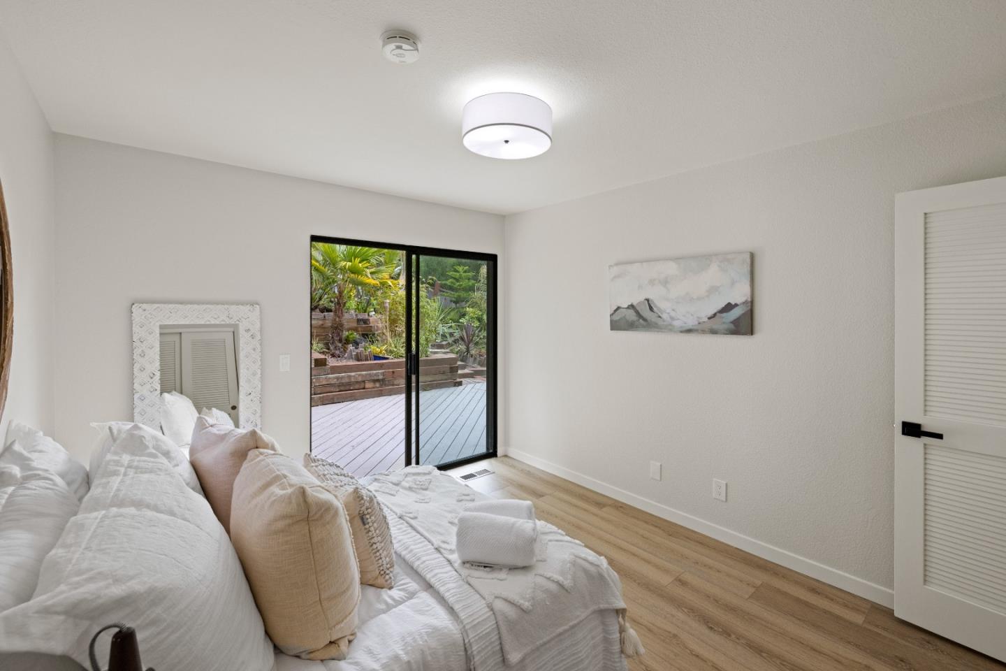 3465 Rio Road Carmel, CA 93923 - Photo 18 of 28 a bedroom with a bed and a large window