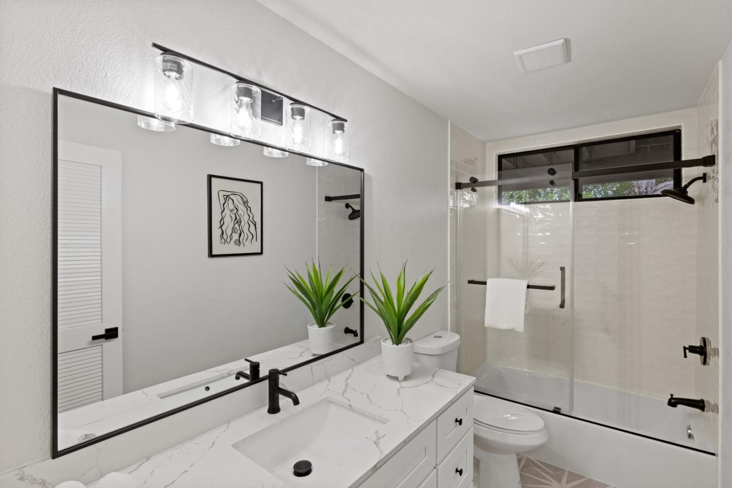 3465 Rio Road Carmel, CA 93923 - Photo 20 of 28 a bathroom with a potted plant and a shower