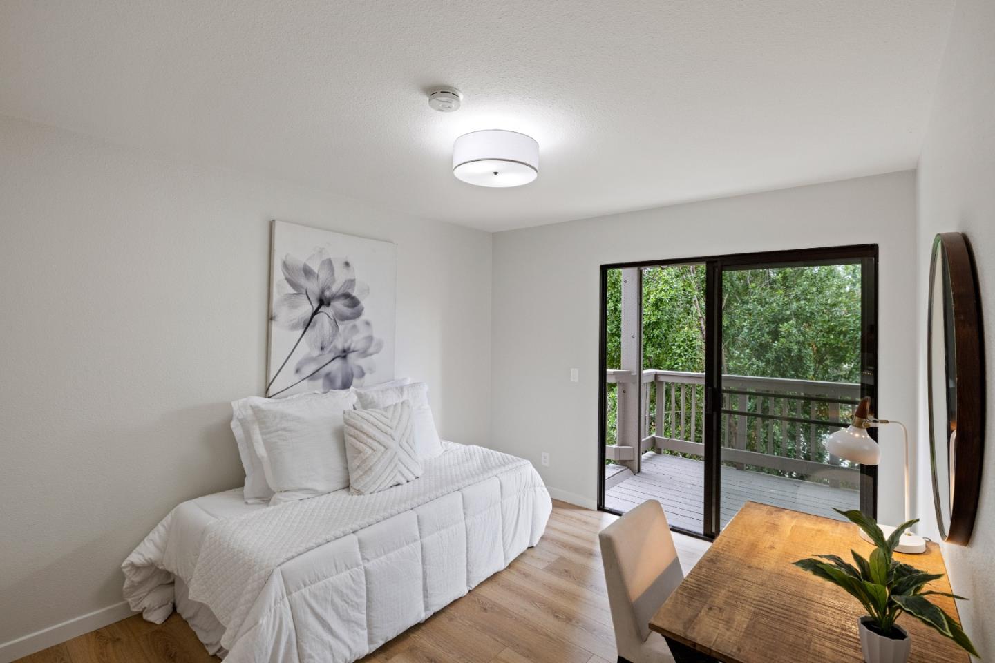 3465 Rio Road Carmel, CA 93923 - Photo 22 of 28 a bedroom with a bed and a large window