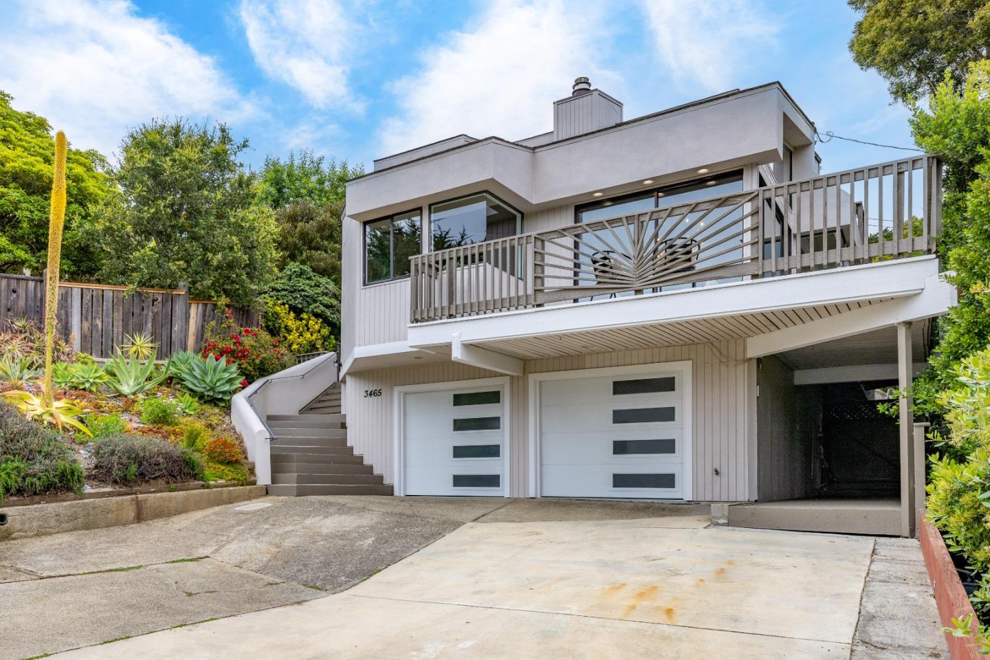 3465 Rio Road Carmel, CA 93923 - Photo 24 of 28 a front view of a house with a garden