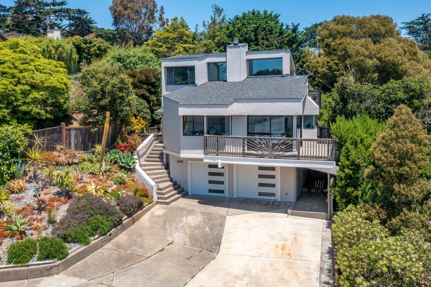 3465 Rio Road Carmel, CA 93923 - Photo 28 of 28 a front view of a house with a garden