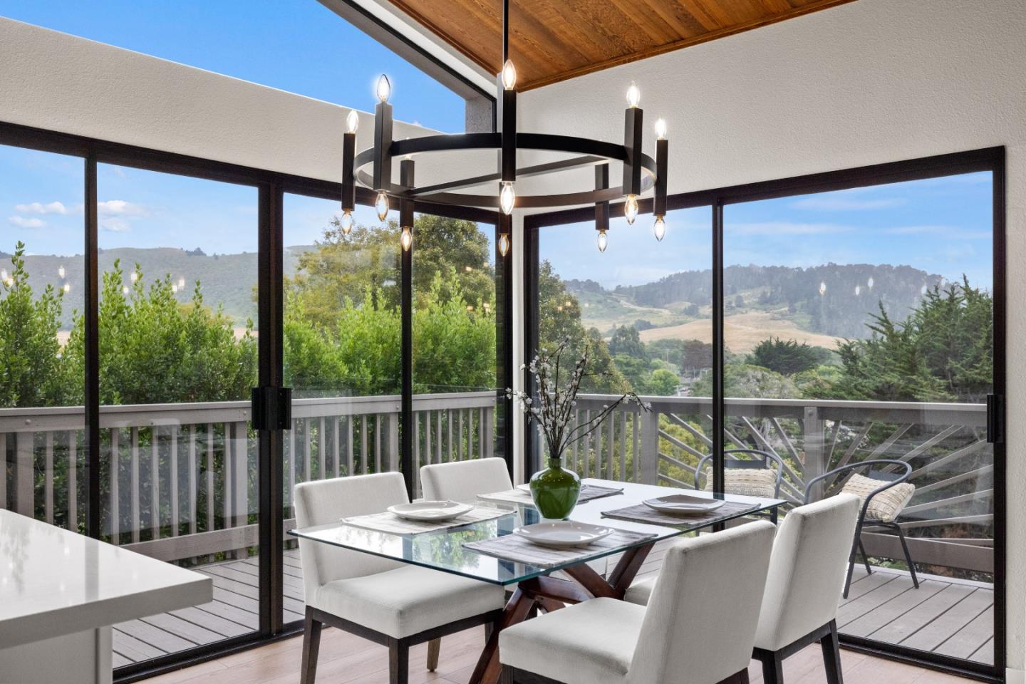 3465 Rio Road Carmel, CA 93923 - Photo 7 of 28 a view of a patio with a table chairs and a table