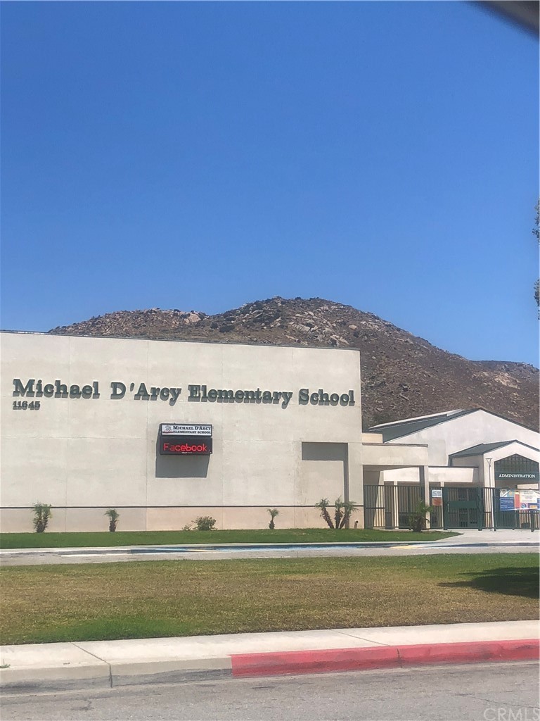 15579 Old Castle Road Fontana, CA 92337 - Photo 5 of 6 a view of a big building with a big yard