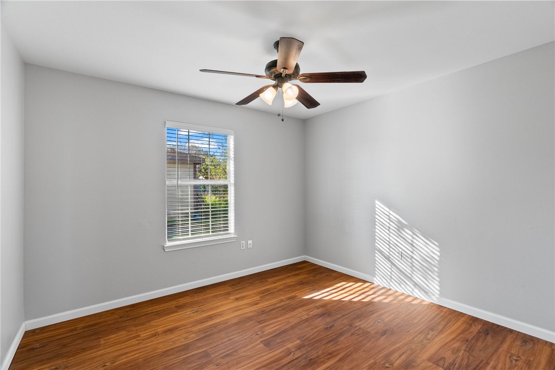 804 Ave B Street Sinton, TX 78387 - Photo 12 of 40 a view of empty room with wooden floor