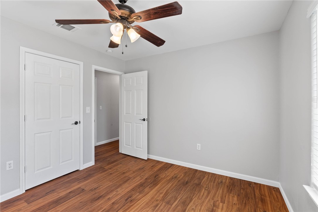 804 Ave B Street Sinton, TX 78387 - Photo 17 of 40 wooden floor in an empty room