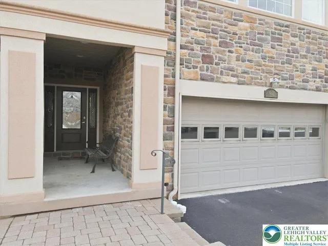 a living room with wooden floor and furniture