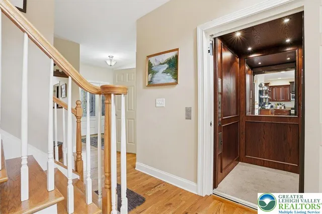 a kitchen with stainless steel appliances granite countertop a refrigerator a stove a sink and dishwasher