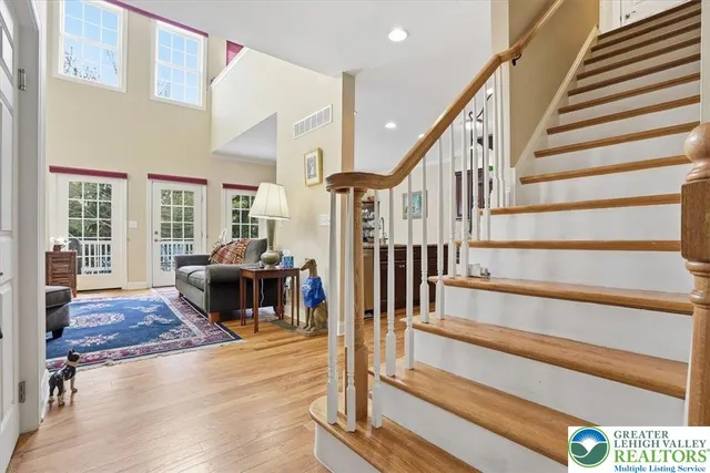 a kitchen with stainless steel appliances granite countertop wooden cabinets and a stove top oven