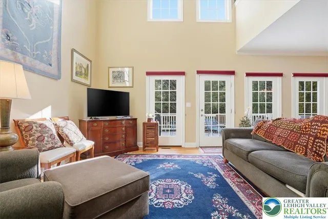 a view of a dining room with furniture and chandelier