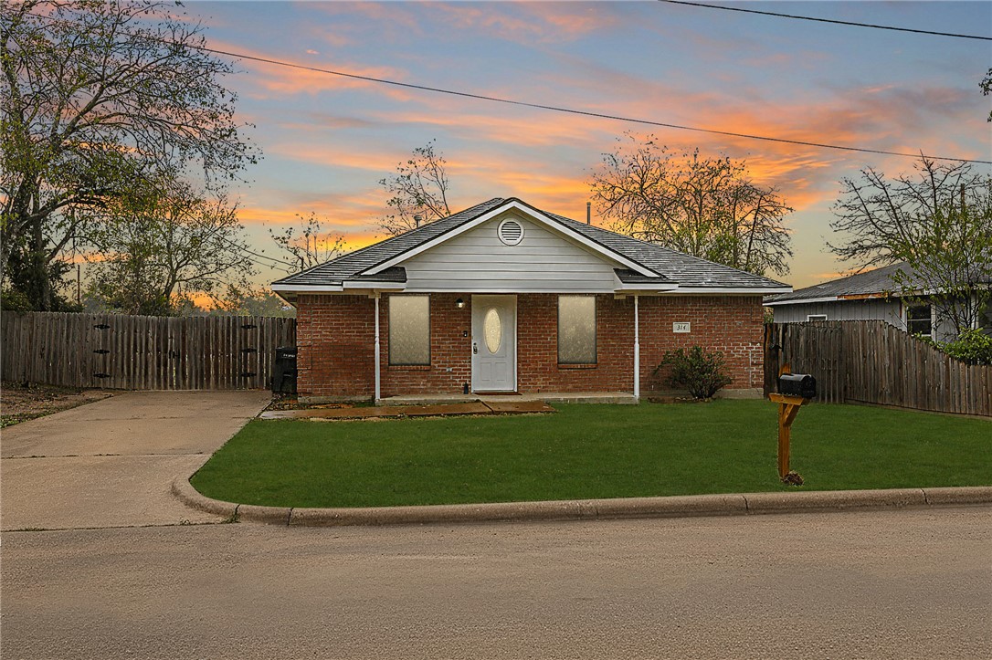 314 Moss Street Bryan, TX 77803 - Photo 1 of 18 a front view of a house with a garden