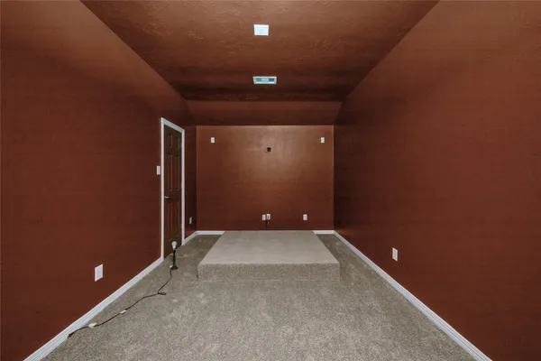 a view of a chandelier in big room and chandelier fan