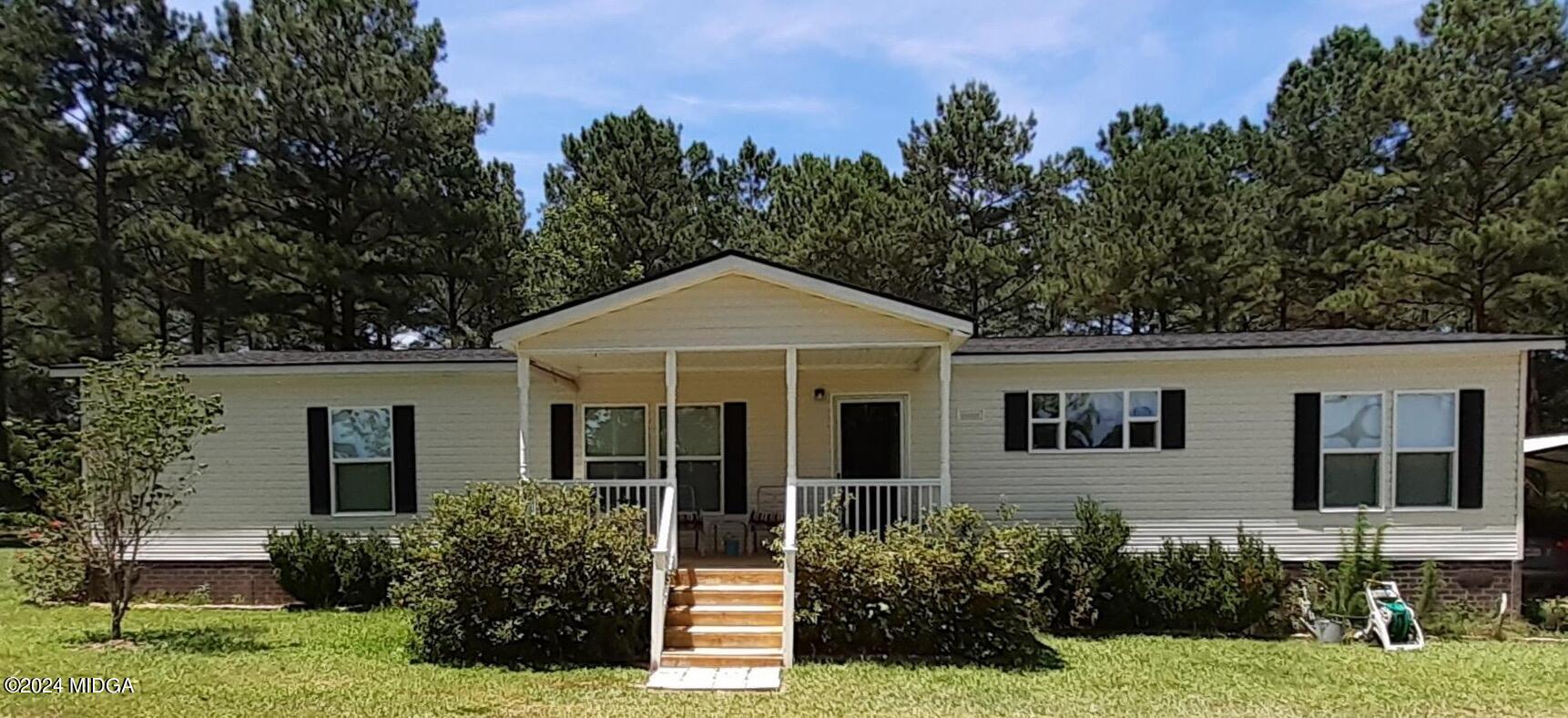 1179 Union Church Road Fort Valley, GA 31030 - Photo 1 of 20 a front view of a house with a yard