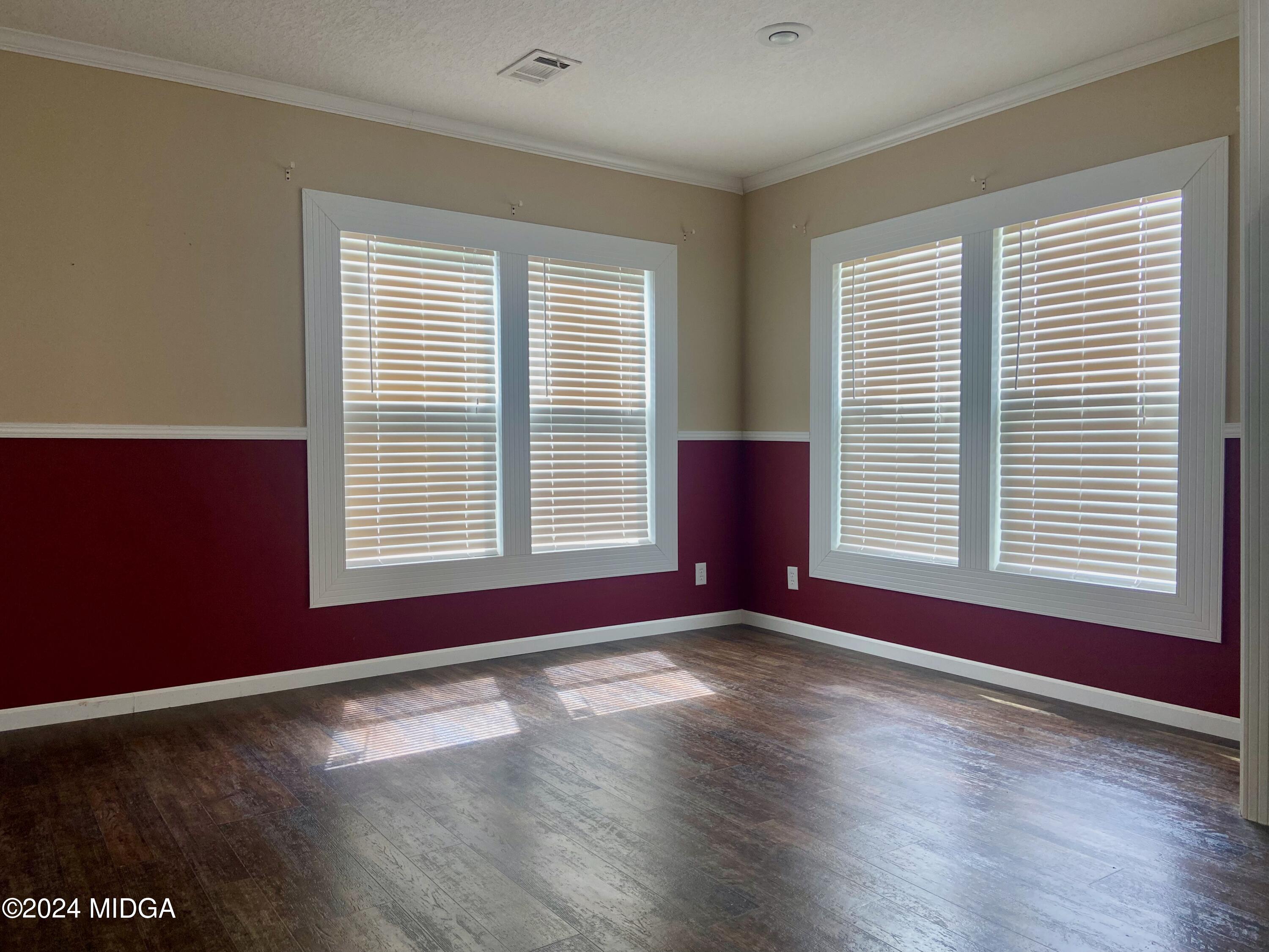 1179 Union Church Road Fort Valley, GA 31030 - Photo 7 of 20 a view of wooden floor and windows in a room