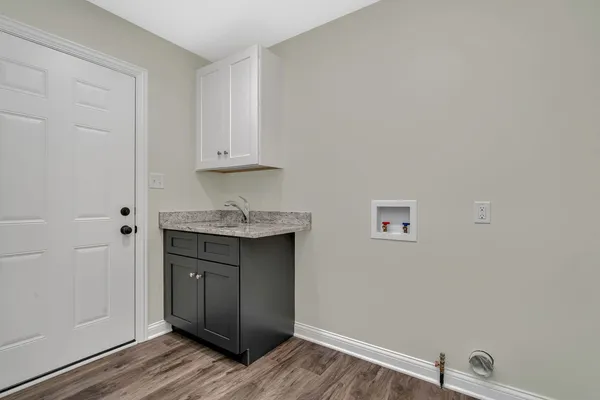 a room with painting and a wooden floor