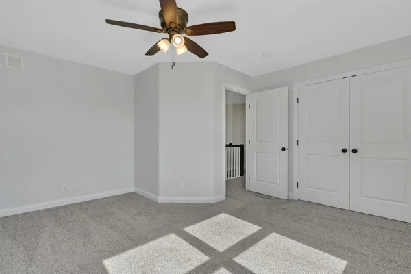 a view of a livingroom with a ceiling fan